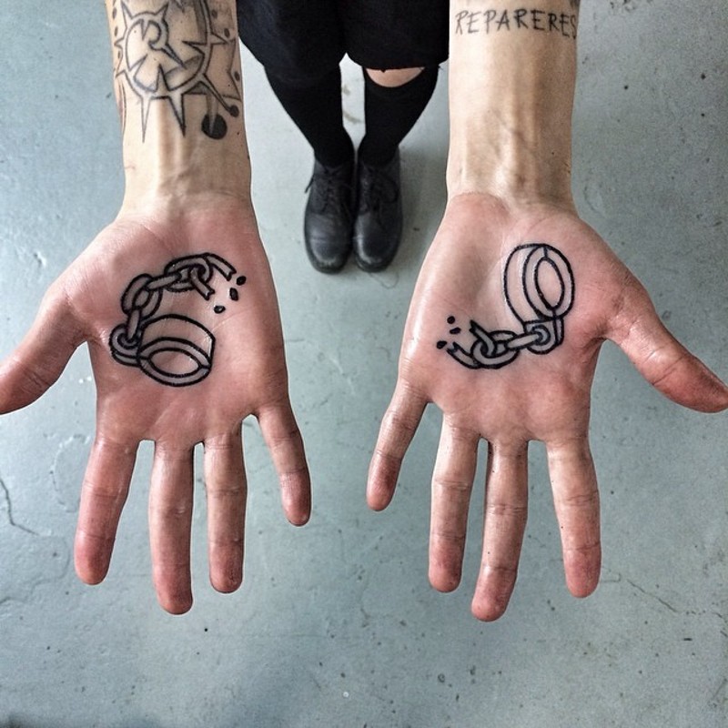 Cool designed black ink broken chains tattoo on hands