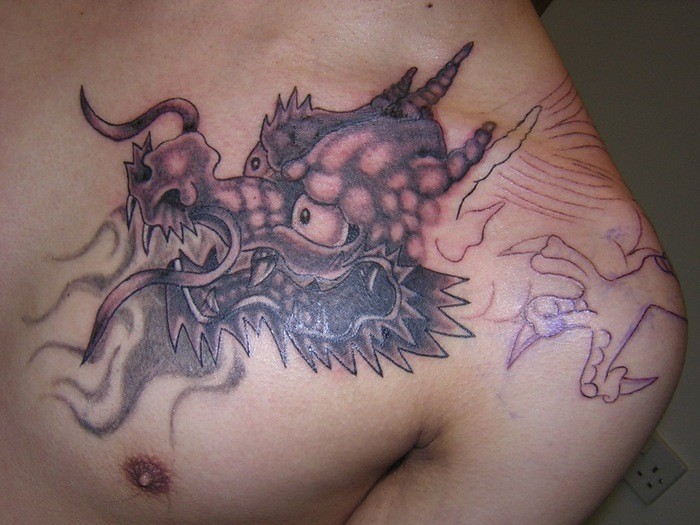 Cool dragon tattoo for man on shoulder
