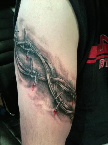 Cool idea of barbed wire armband tattoo for men