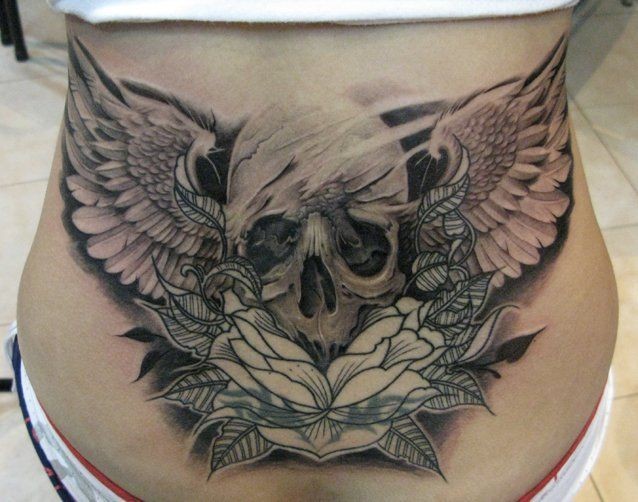 Cool idea of skull tattoo on lower back