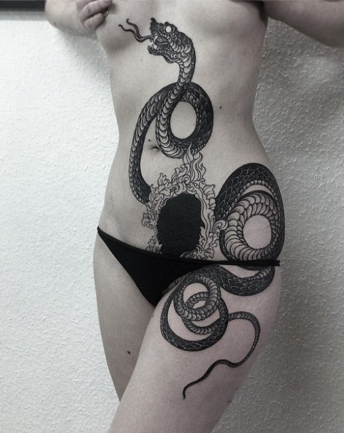Cool idea of snake tattoo for girl
