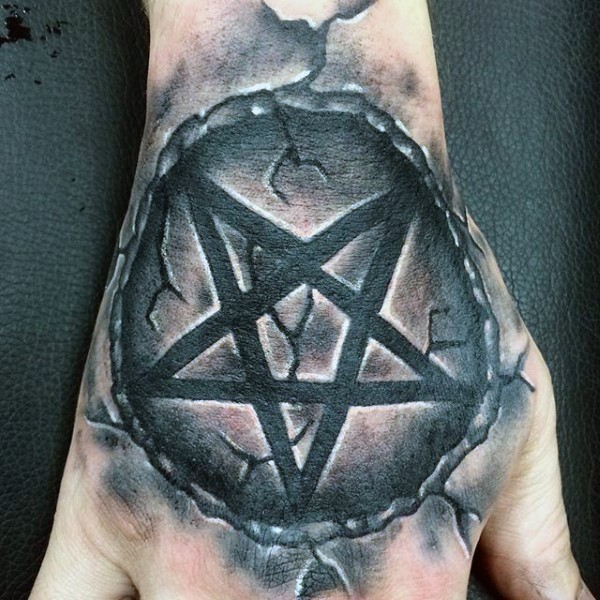 Cool illustrative style hand tattoo of stone demonic star