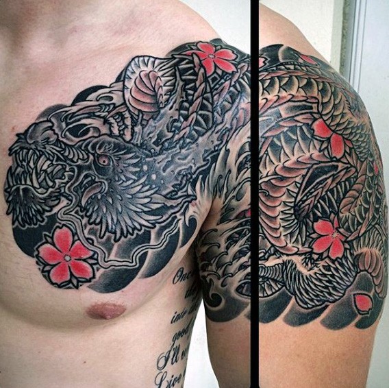Cool looking colored and detailed dragon tattoo on shoulder and chest with flowers