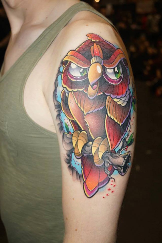 Cool looking colored shoulder tattoo of funny owl with tree branch