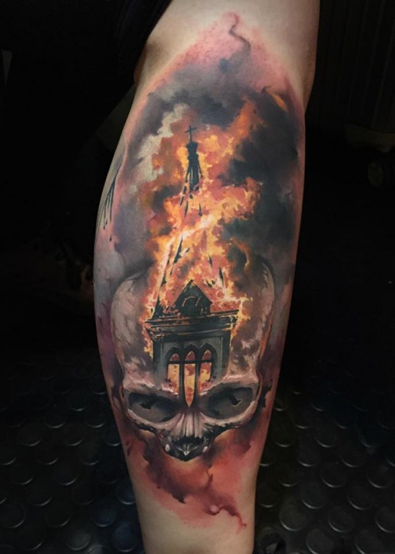 Cool looking colored tattoo of human skull stylized with burning building