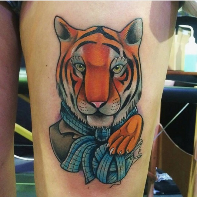 Cool looking thigh tattoo of tiger in suit