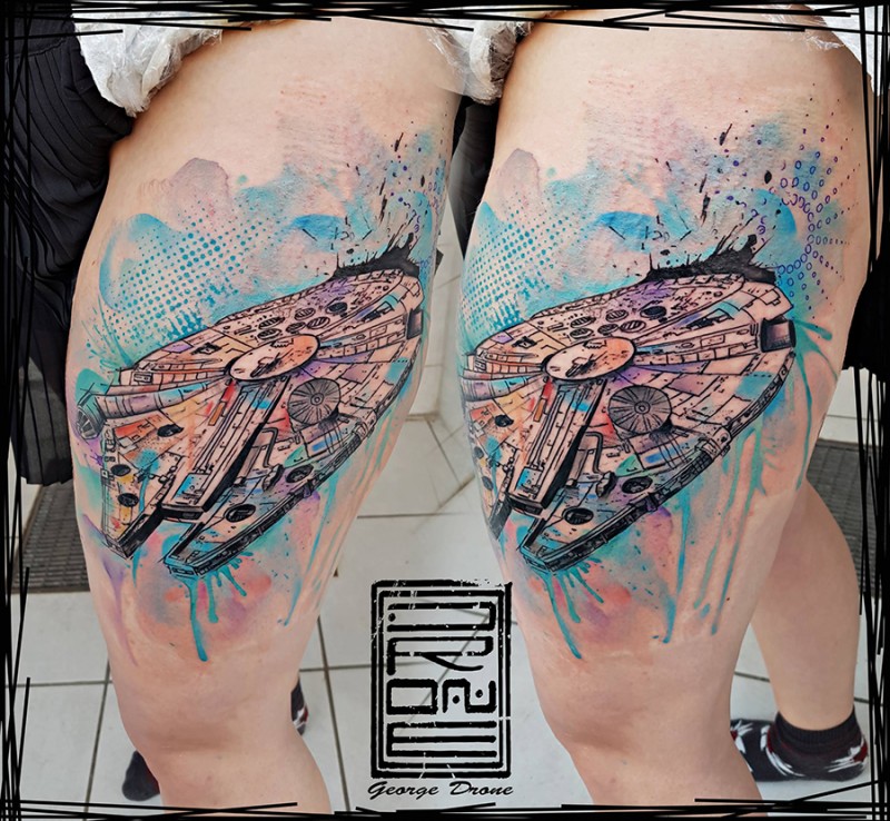 Cool modern looking colored thigh tattoo of millennium falcon ship