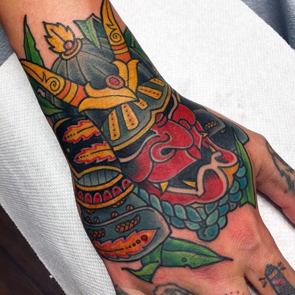 Cool old school style colored funny hand tattoo of samurai helmet
