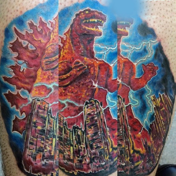 Cool painted colorful evil Godzilla with city tattoo on leg