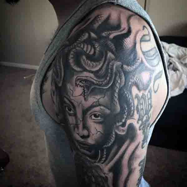 Cool painted creepy black ink Medusa head tattoo on sleeve zone