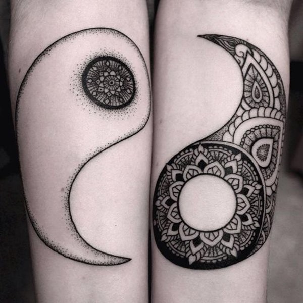 Cool painted forearm tattoo of Yin Yang symbol parts