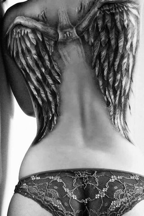 Cool painted massive black ink angel wings tattoo on upper back