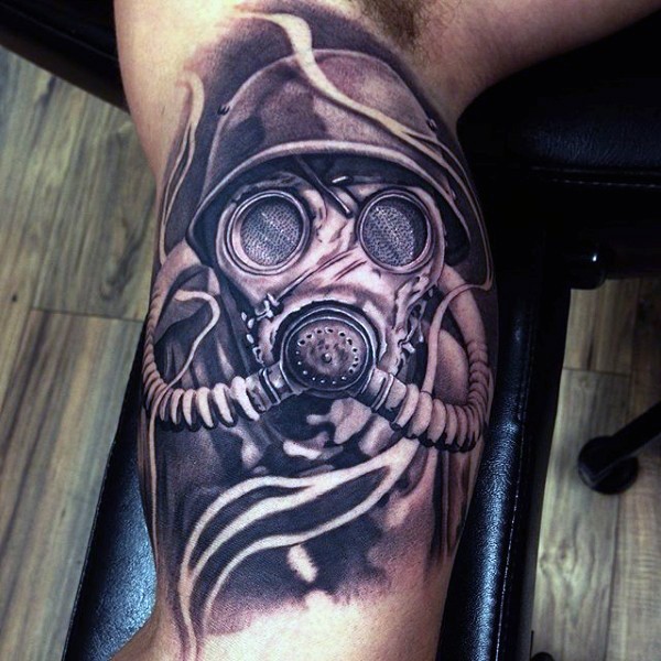Cool painted realism style biceps tattoo of soldier in gas mask