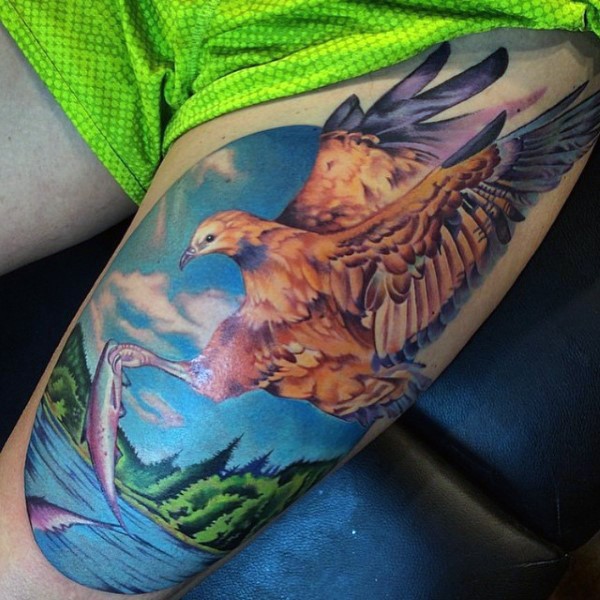 Cool painted realistic looking and colored fishing eagle tattoo on thigh