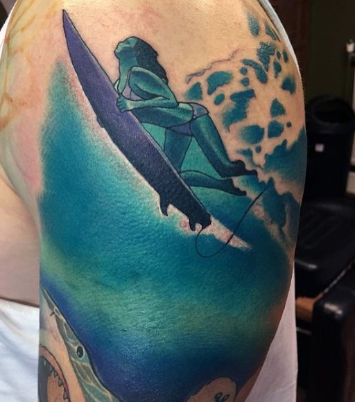 Cool painted woman surfer in water shoulder tattoo with shark