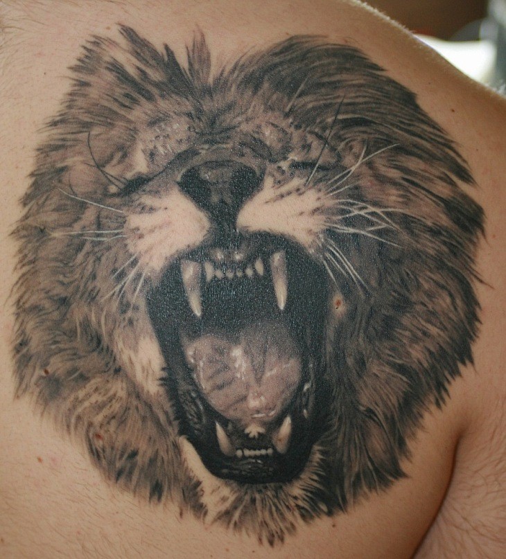 Cool roaring lion tattoo on chest