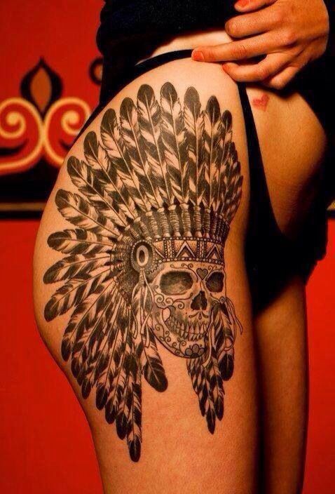 Cool skull in an indian headdress tattoo on thigh