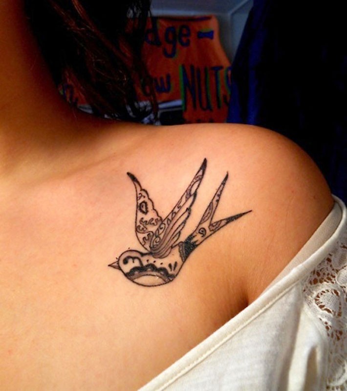 Cool small bird tattoo on collarbone
