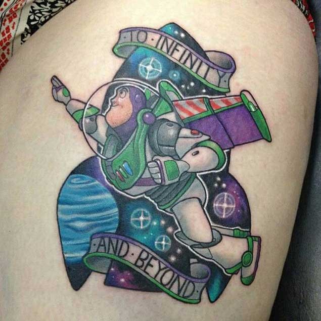 Cool Toy Story cartoon robot hero tattoo with lettering