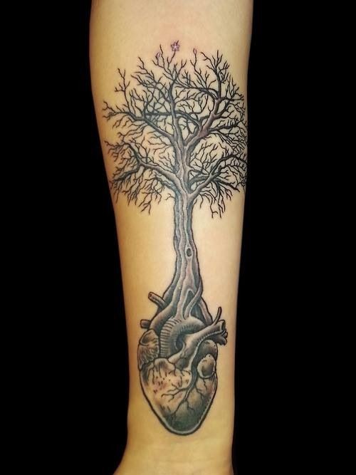 Cool tree grown from a heart tattoo on forearm