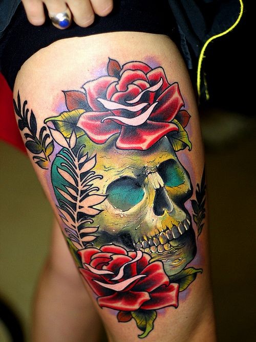 Cool very realistic big colored skull with flowers tattoo on thigh
