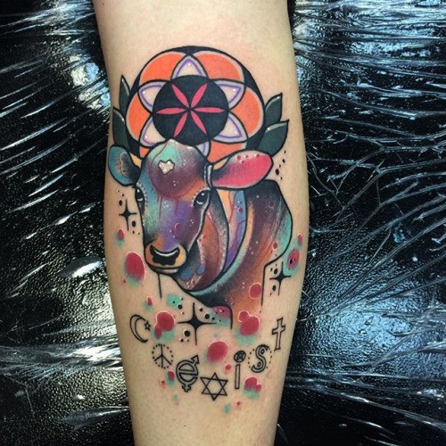 Cool watercolor like little mystical cow with flower tattoo on arm combined with various  symbols