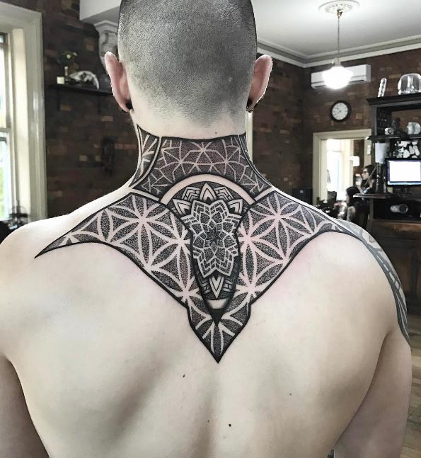 Creative dot style upper back tattoo of enormous ornament
