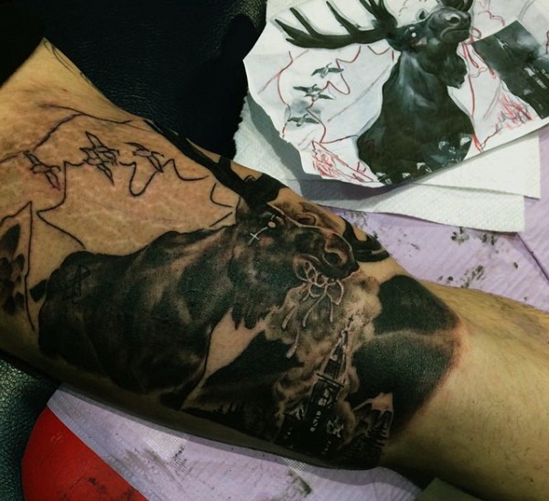 Creepy black and white mystical elk tattoo on biceps with dark cathedral