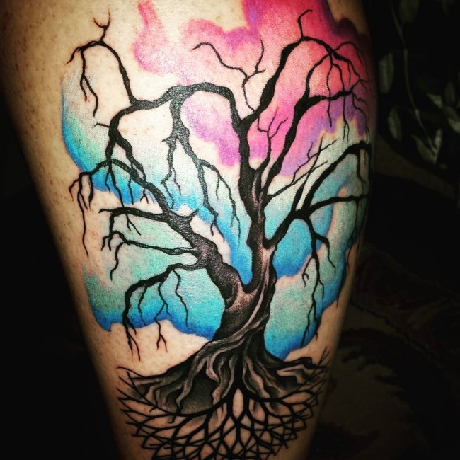 Creepy colored lonely tree tattoo with multicolored abstract sky