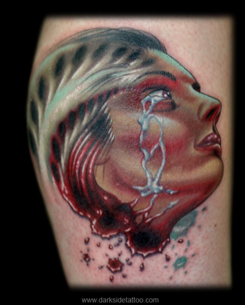 Creepy colored severed woman`s head bloody tattoo