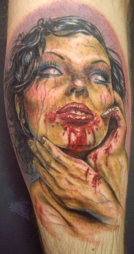 Creepy designed and painted detailed bloody female zombie tattoo on arm