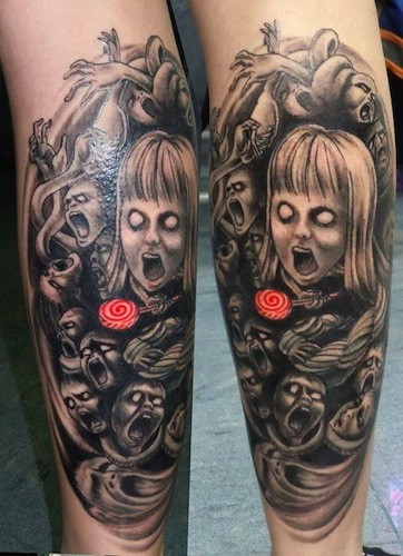 Creepy horror style black and white leg tattoo of various monsters with lollipop
