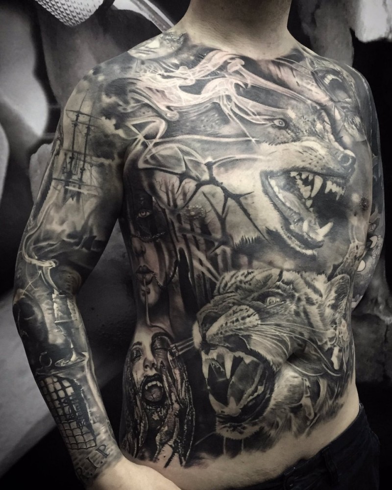 Creepy horror style black ink whole body tattoo of various monsters and animals