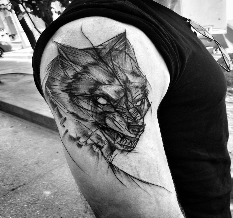 Creepy horror style painted by Inez Janiak upper arm tattoo of angry wolf
