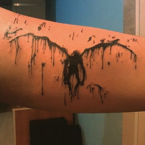 Creepy looking abstract style arm tattoo of demon