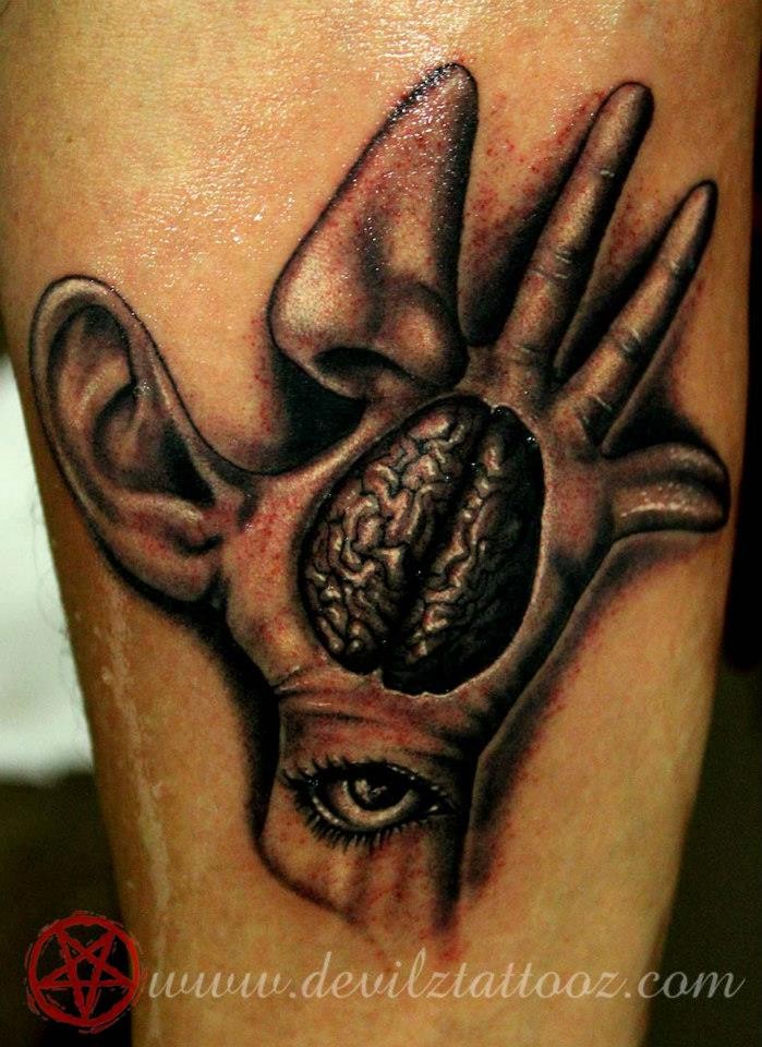 Creepy looking black and gray style tattoo of various human body parts