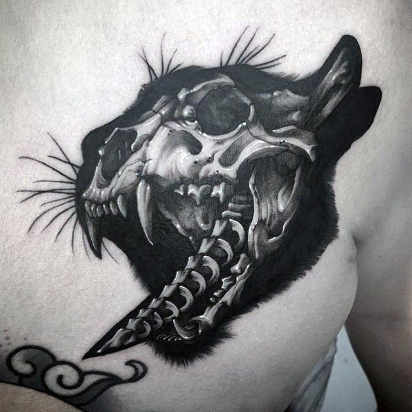 Creepy looking black and white chest tattoo of cat skull bones