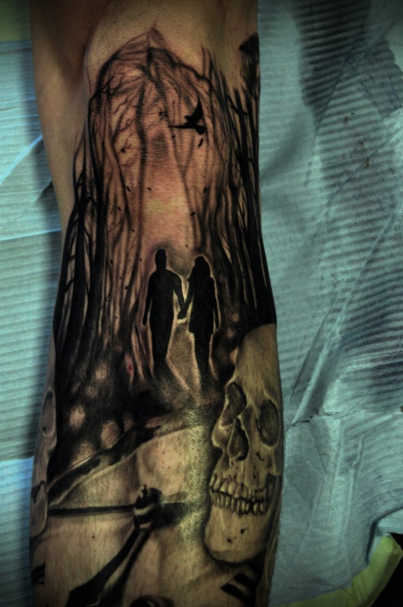 Creepy looking black and white half sleeve tattoo of people in dark forest with skull