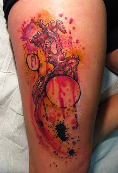 Creepy looking bloody thigh tattoo of human heart