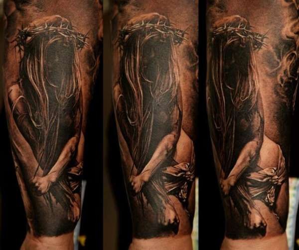 Creepy looking colored forearm tattoo of mystical woman with vine