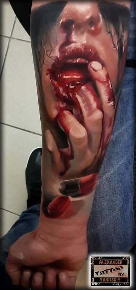 Creepy looking colored forearm tattoo of bloody woman&quots mouth
