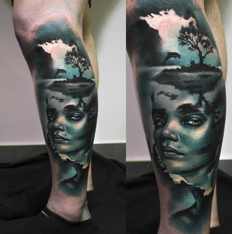 Creepy looking colored leg tattoo of woman portrait with small island and dolphin