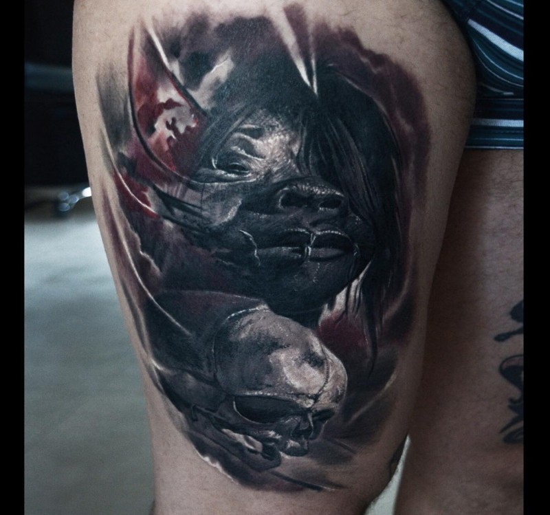 Creepy looking colored thigh tattoo of demonic woman with human skull