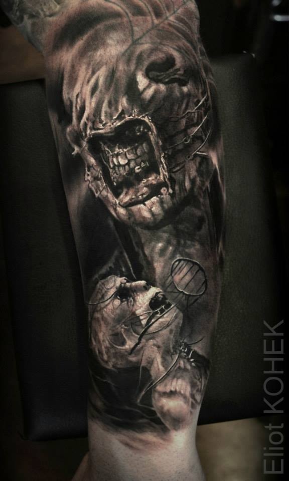 Creepy looking detailed arm tattoo of evil monsters