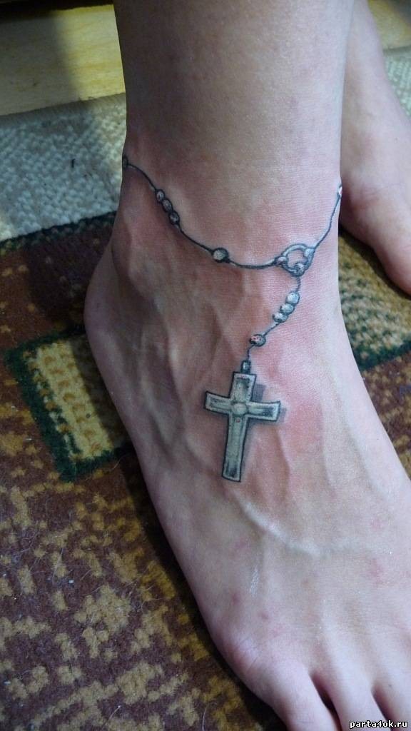 Cross with beads on foot tattoo