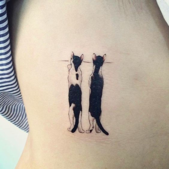 Cute art style colored tattoo of two standing cats