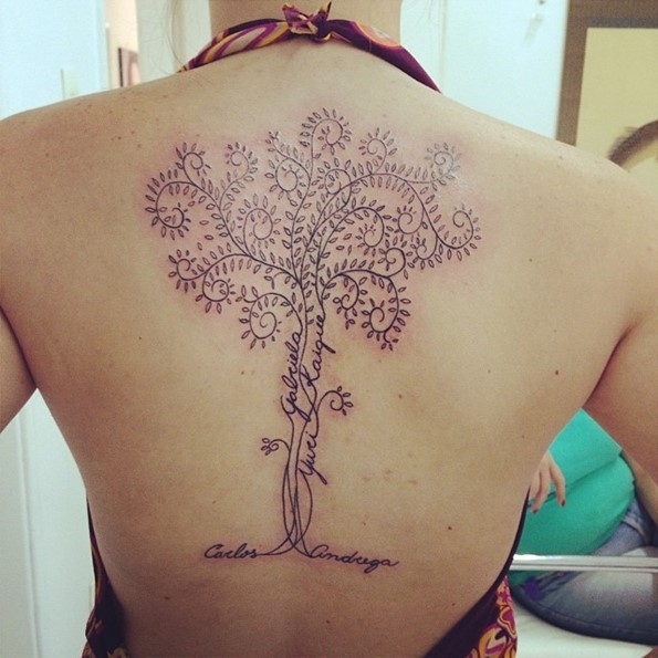Cute big black ink lonely tree tattoo on back stylized with lettering