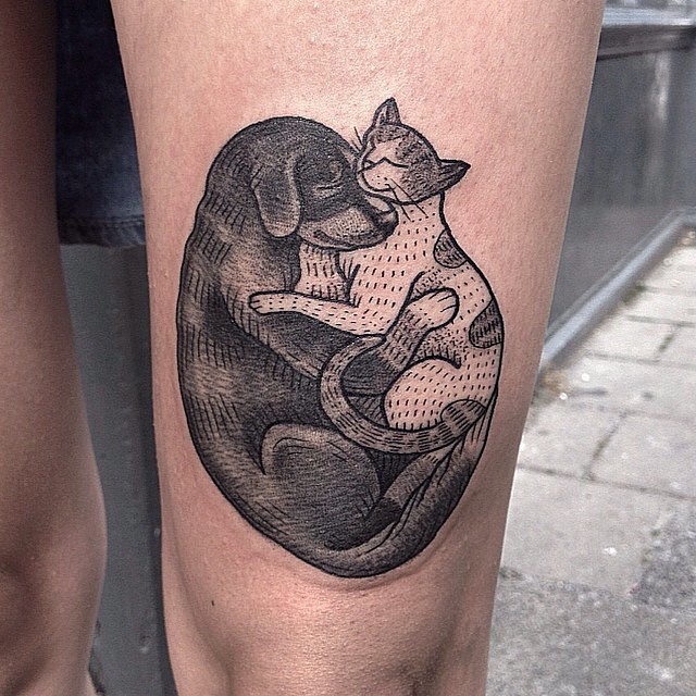 Cute black ink hugging cat and dog tattoo on thigh