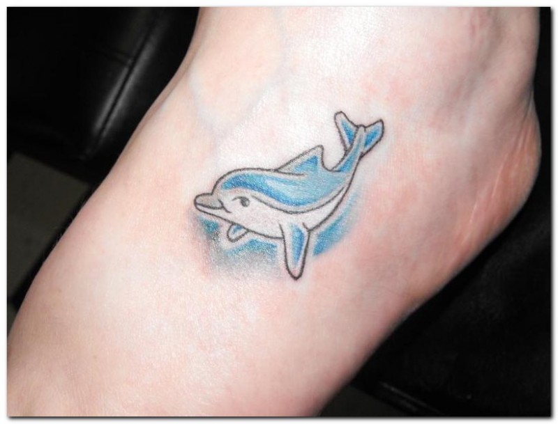 Cute blue dolphin tattoo on foot
