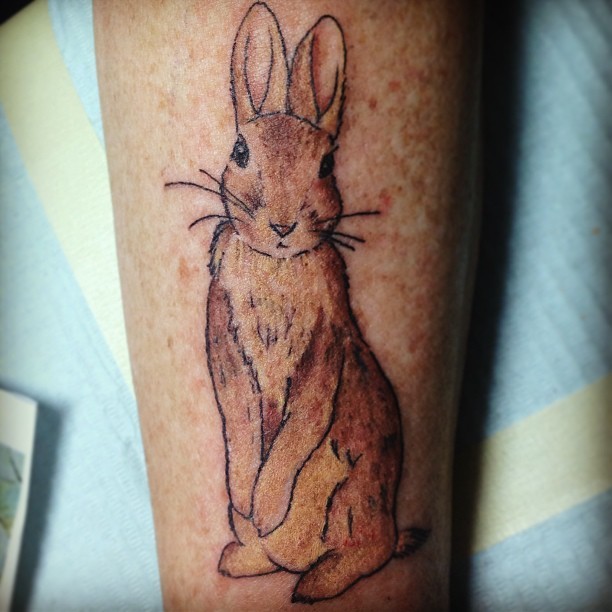 Cute brown rabbit tattoo